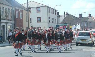 The Welsh Pipe Band lead the parade down Cornwall Street